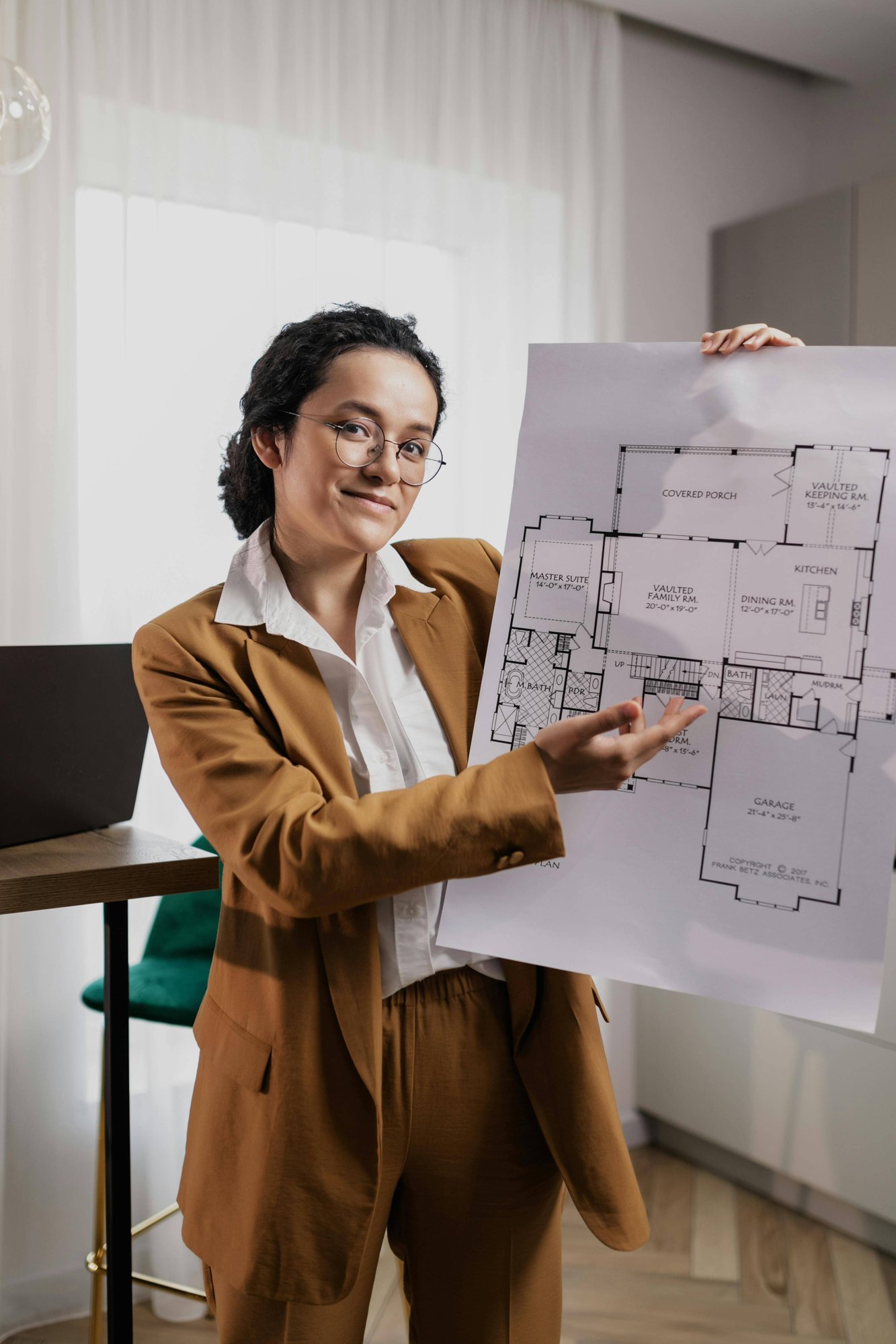woman holding a blueprint