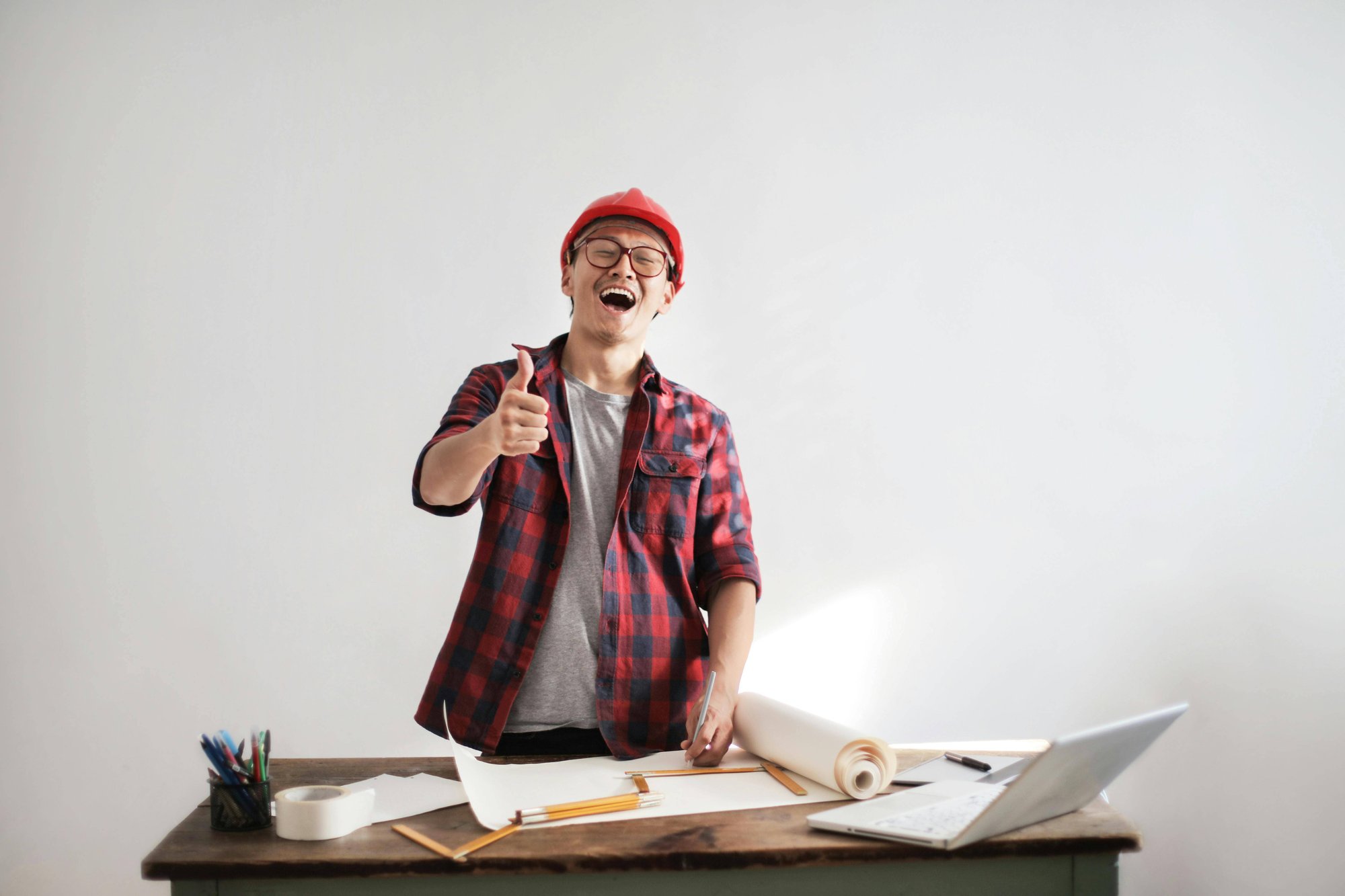 man in hard hat giving thumbs up